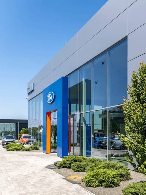 Silver electric SUV at Olfin Car dealership